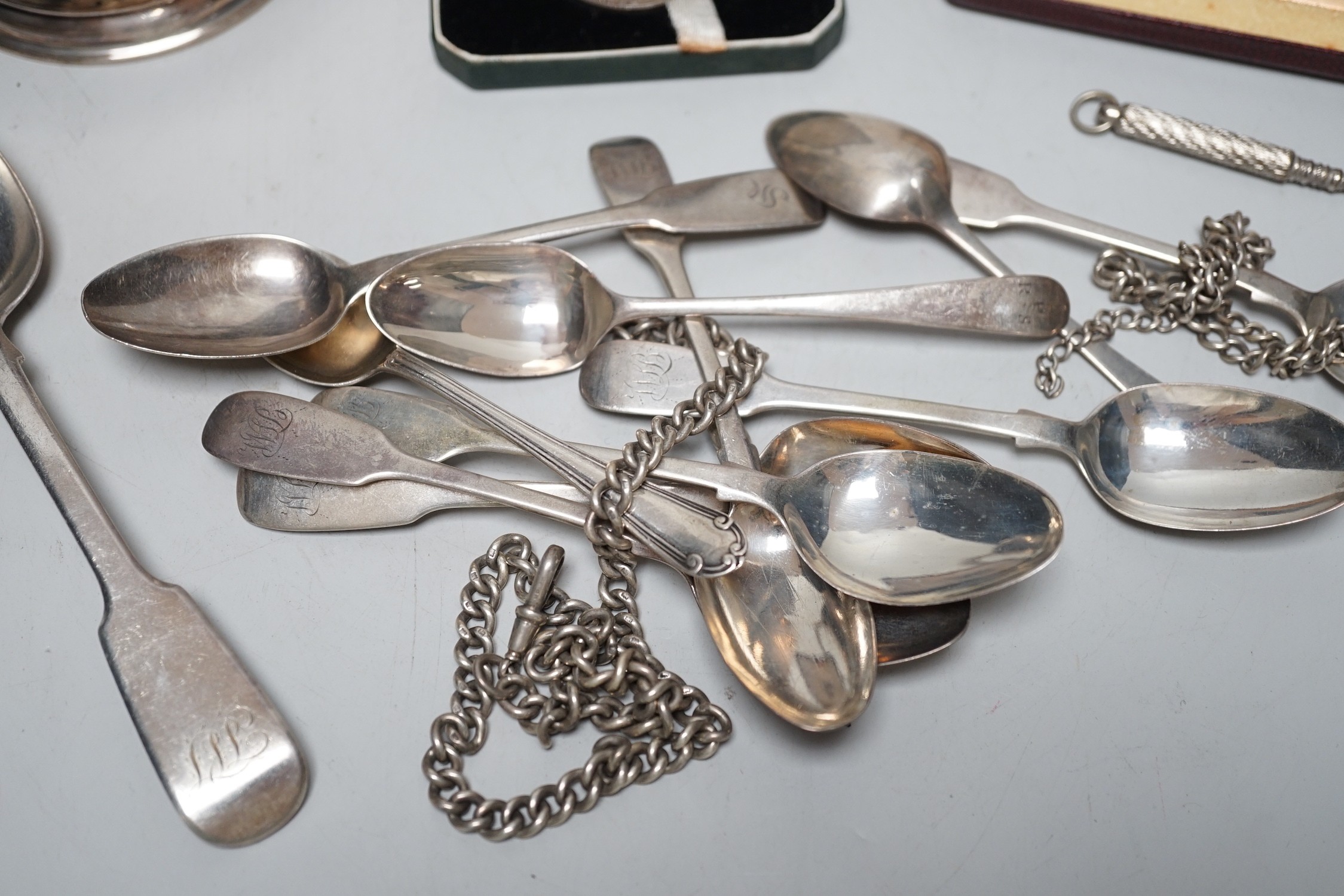 A George VI silver mug, with engraved inscription, James Dixon and Sons, Sheffield, 1943, 11.3cm, together with twelve items of silver flatware including set of six William IV silver fiddle pattern teaspoons, a silver al